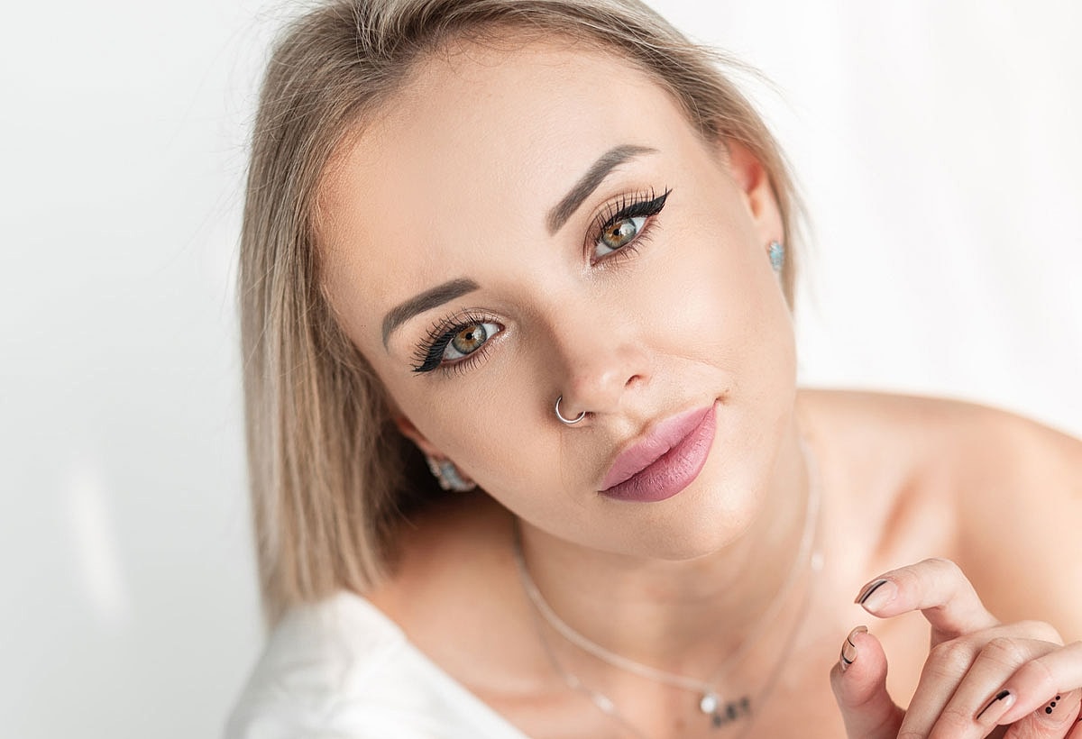 Portrait of a woman with striking features.