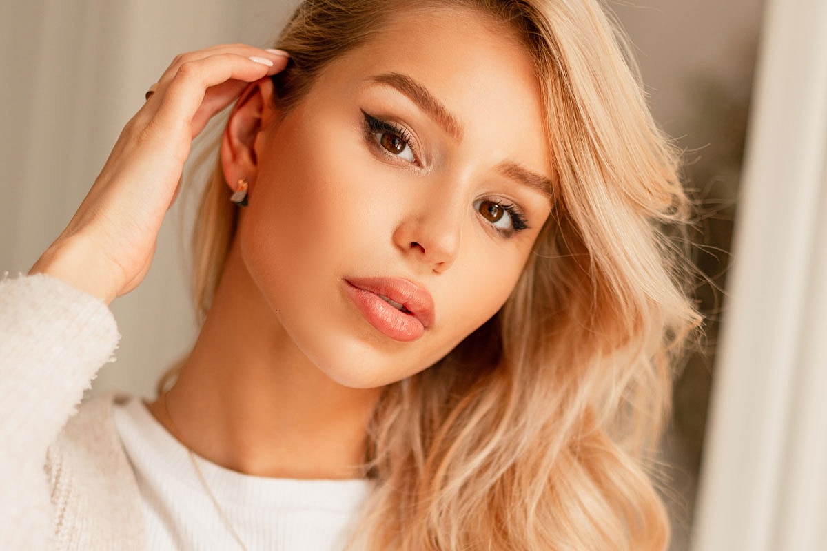 Close-up of a woman with blonde hair.