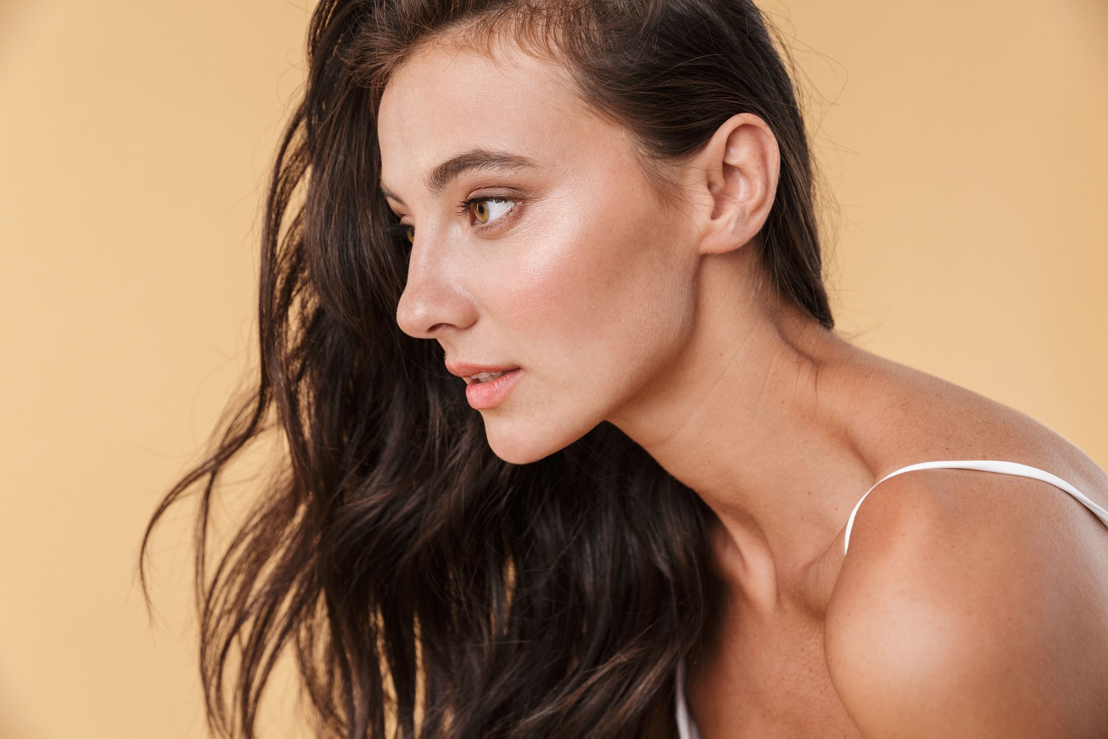 Profile view of woman with long, dark hair.
